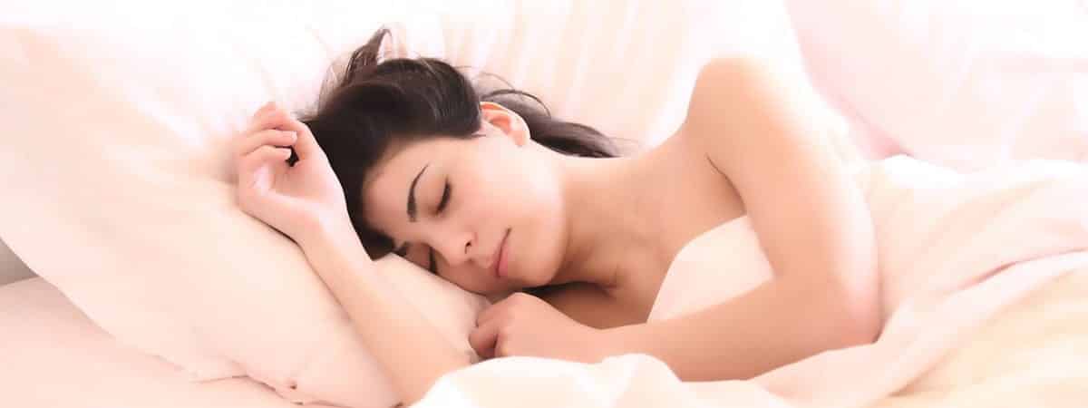 woman sleeping on bed